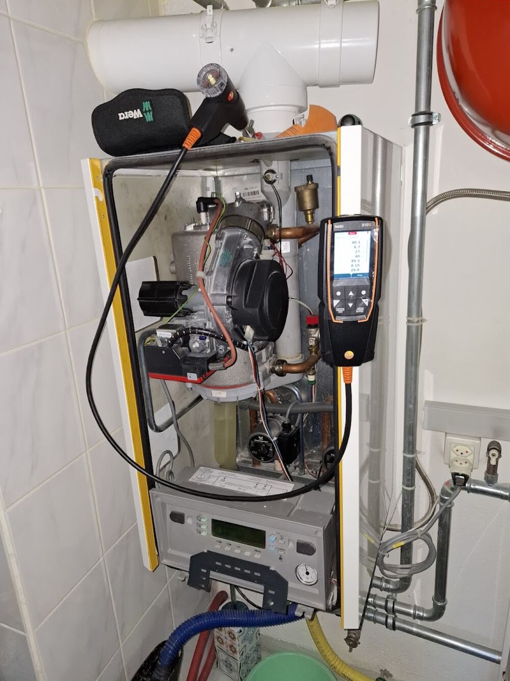 Entretien annuel chaudière Vaillant avec analyseur Testo 310 — AMIAR Services Sàrl